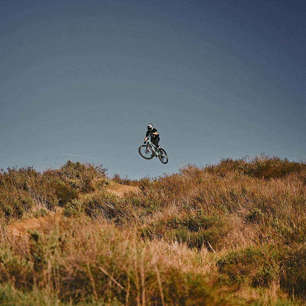 Man jumping in air on MTB bike